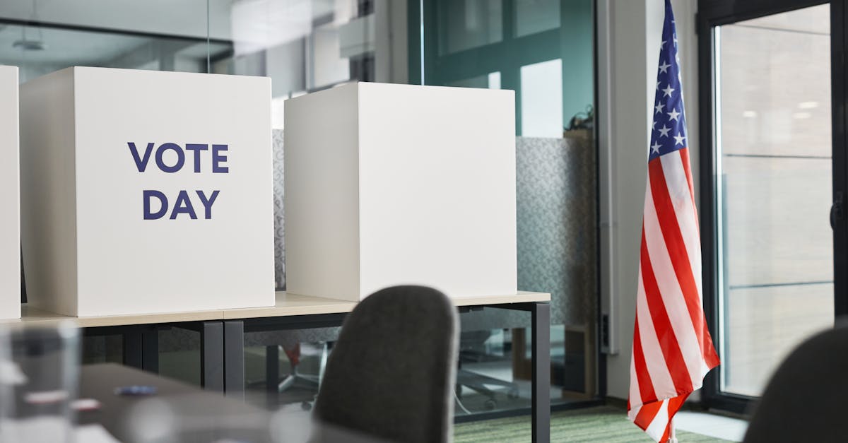 Voting booths with American flag inside a polling station