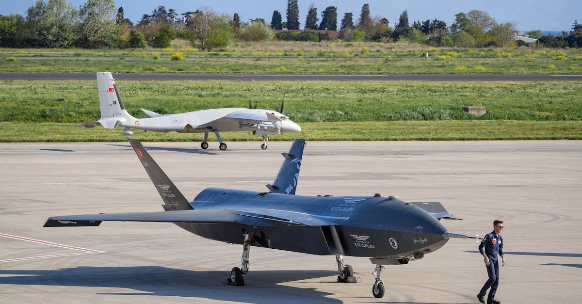 Advanced military drones on a tarmac, illustrating the autonomous-systems segment Anduril builds for