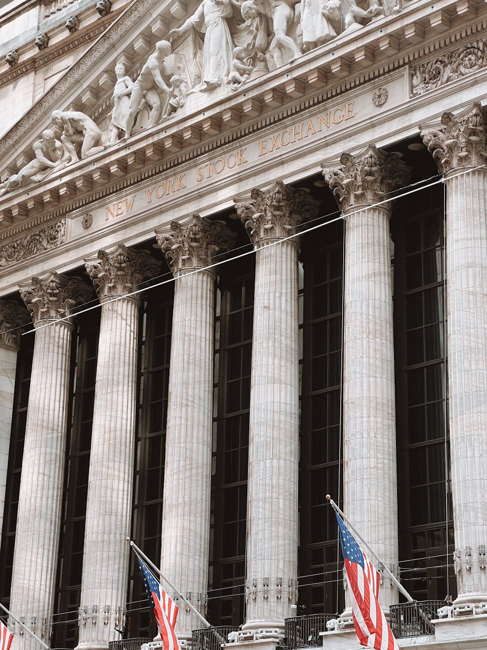 New York Stock Exchange facade with American flags and columns