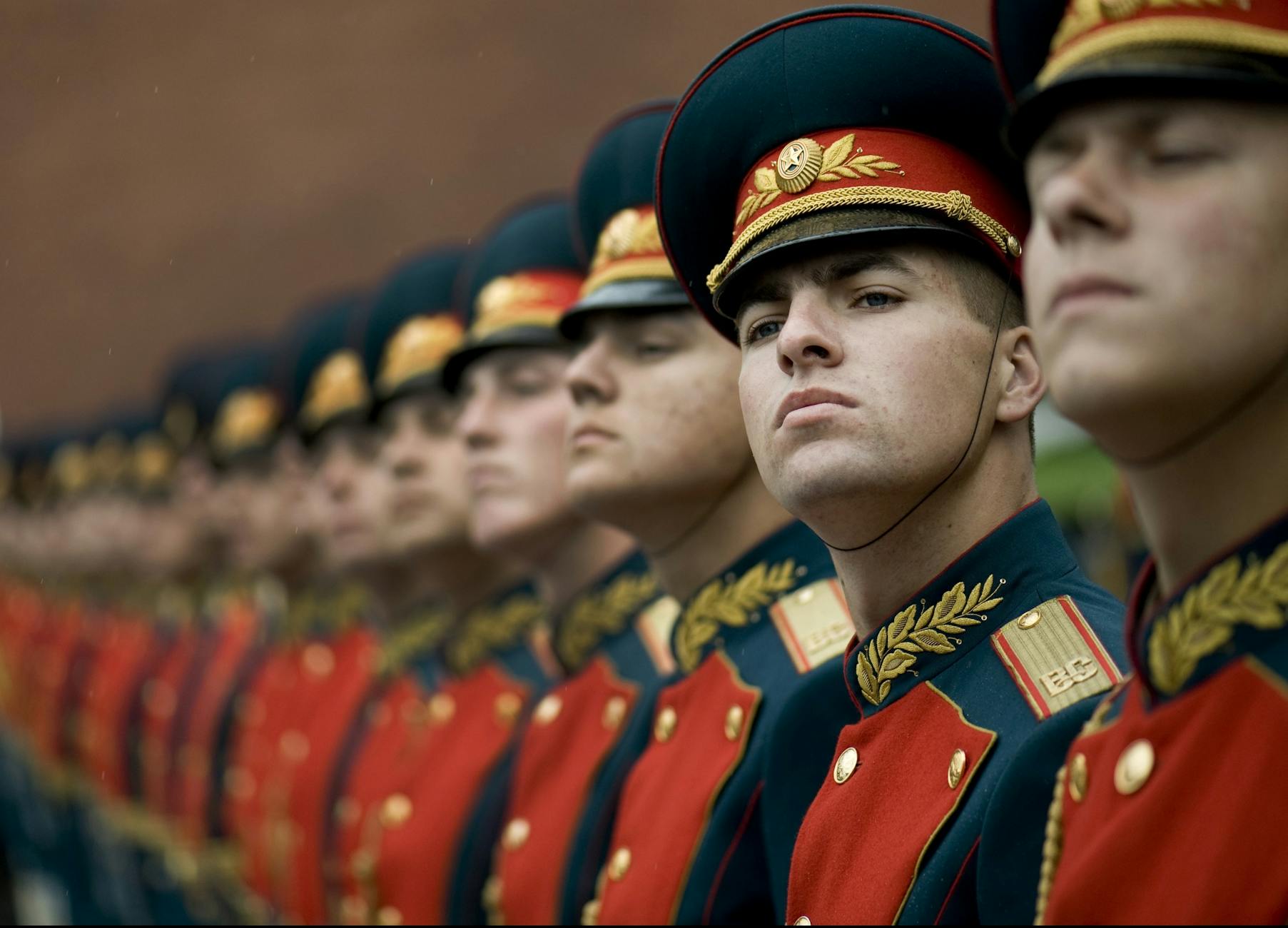 Russian soldiers in ceremonial uniforms standing in parade formation