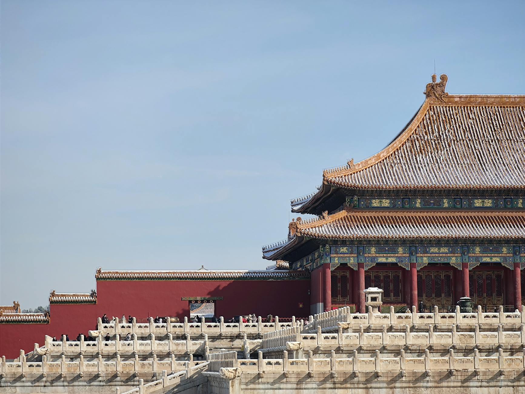 Forbidden City rooftops in Beijing under a clear winter sky