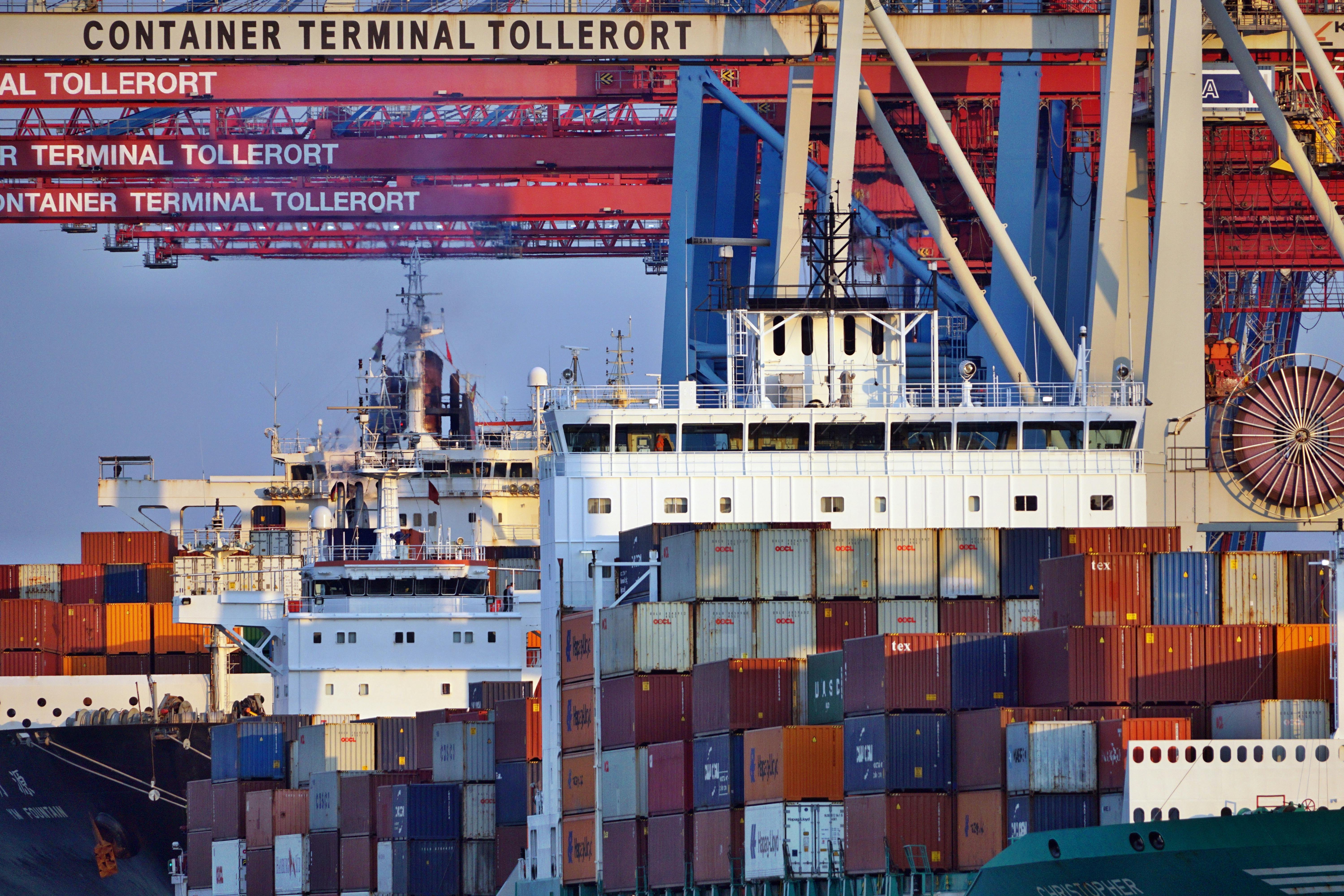 Container ships docked at Tollerort Terminal, Hamburg during sunset