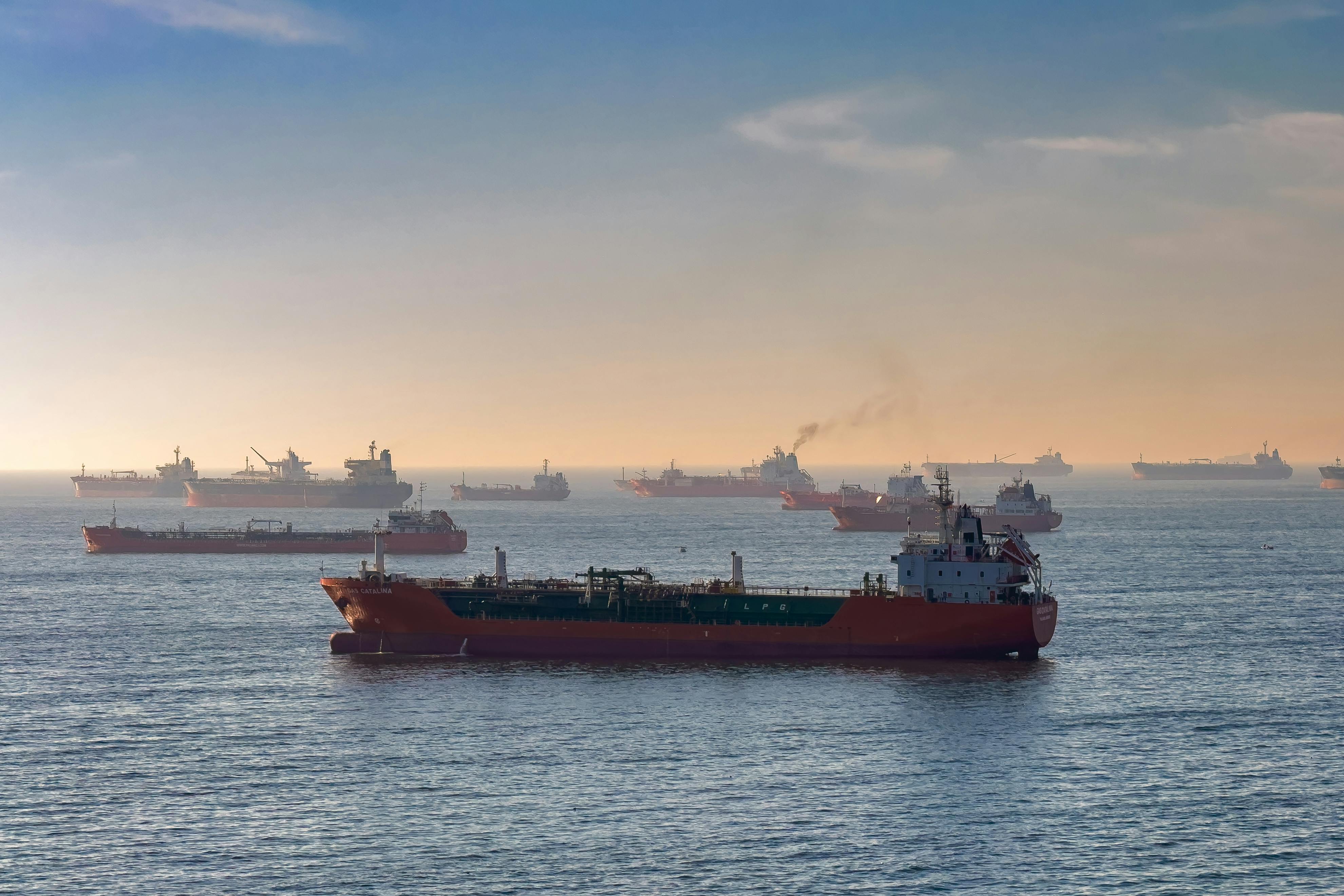 Cargo ships and oil tankers on the Bosporus strait at sunset, capturing global maritime trade