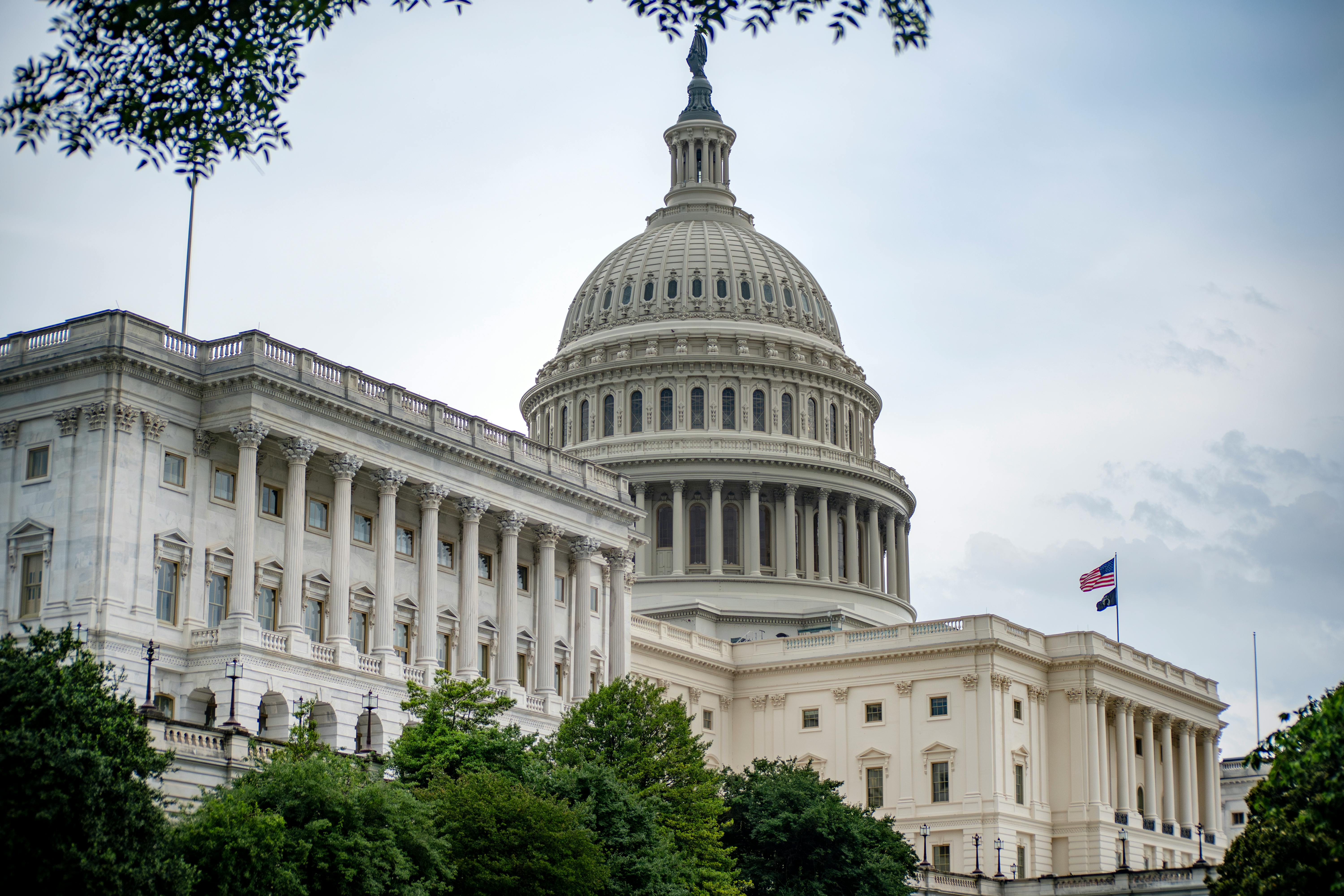 US Capitol Building dome with American flag in Washington DC