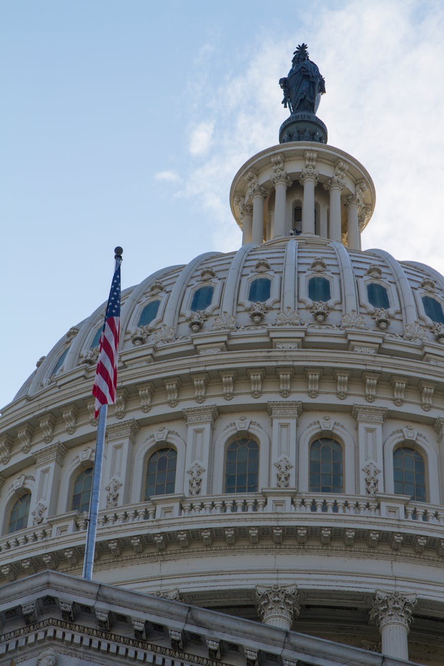 Close-up of the iconic US Capitol dome with American flag in Washington, DC