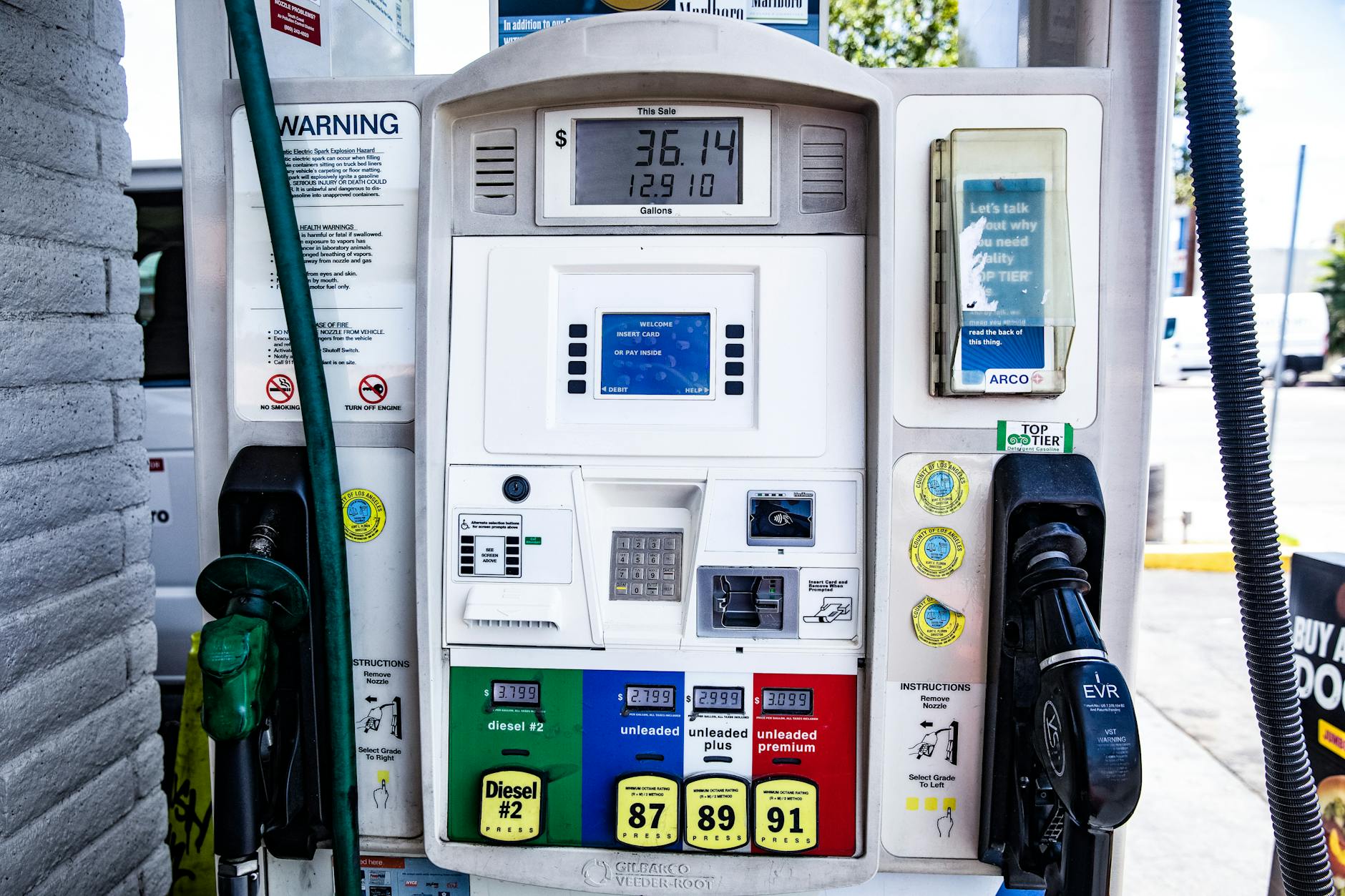Close-up of a fuel pump showing gasoline and diesel options at a gas station in Los Angeles