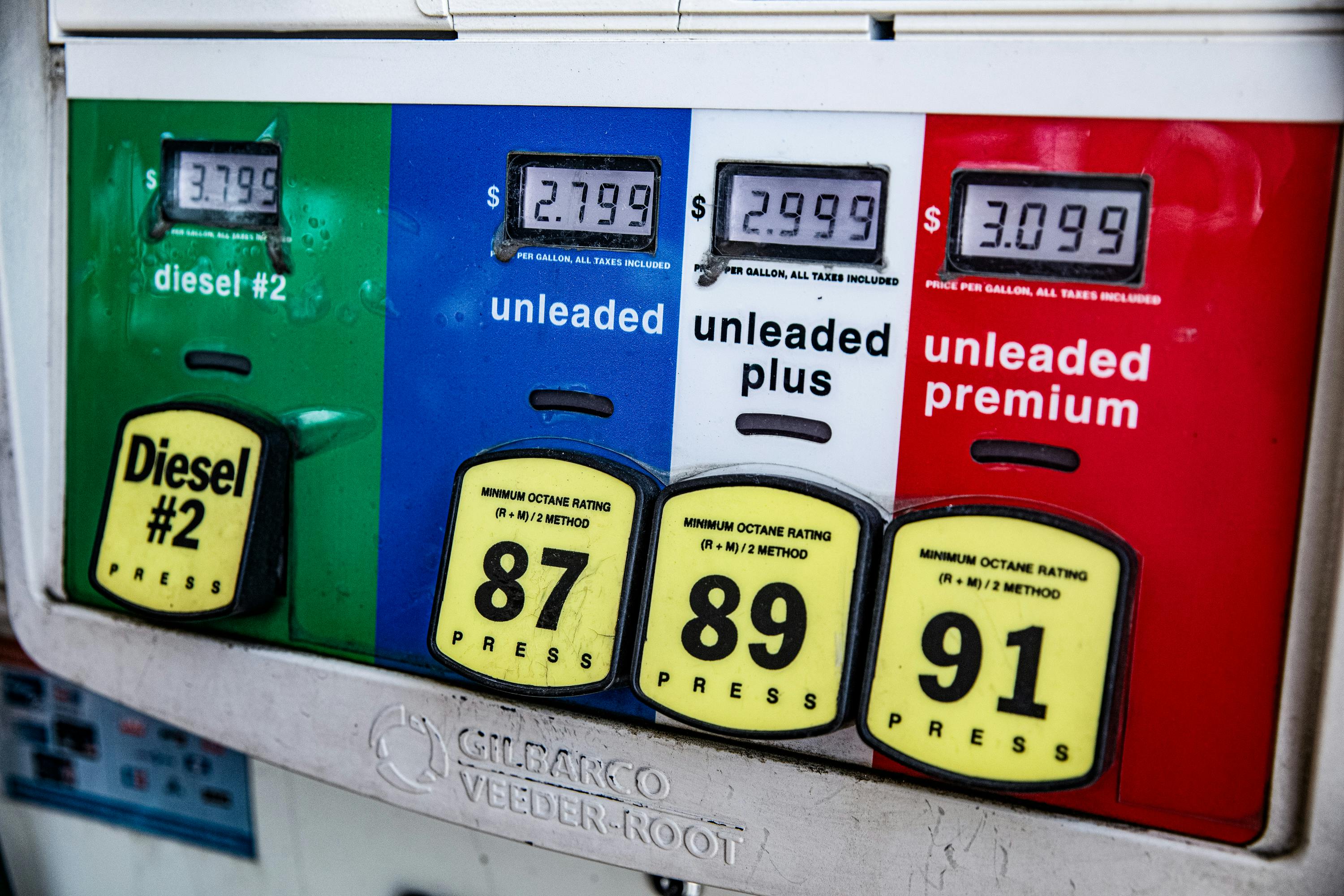 Close-up of a gas pump showing fuel prices and octane ratings