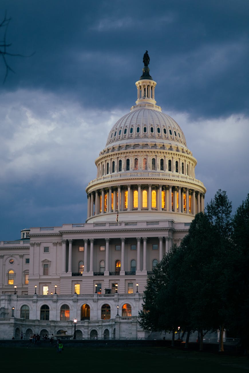 A stunning view of the illuminated US Capitol Building against a twilight sky in Washington, DC.
