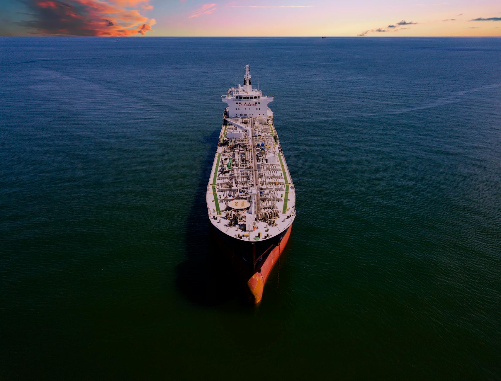 Aerial shot of an oil tanker on the ocean at sunset in Galveston, Texas.