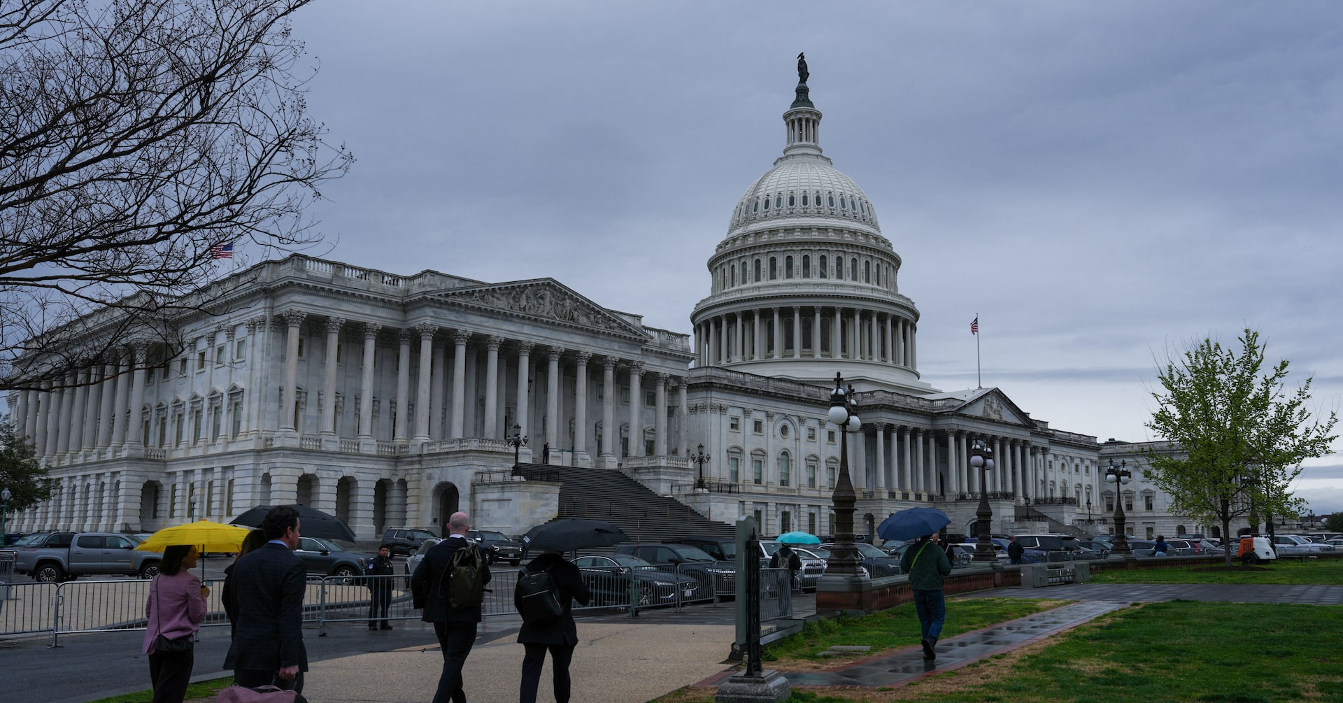 People walk near the U.S. Capitol building on Capitol Hill in Washington, D.C.