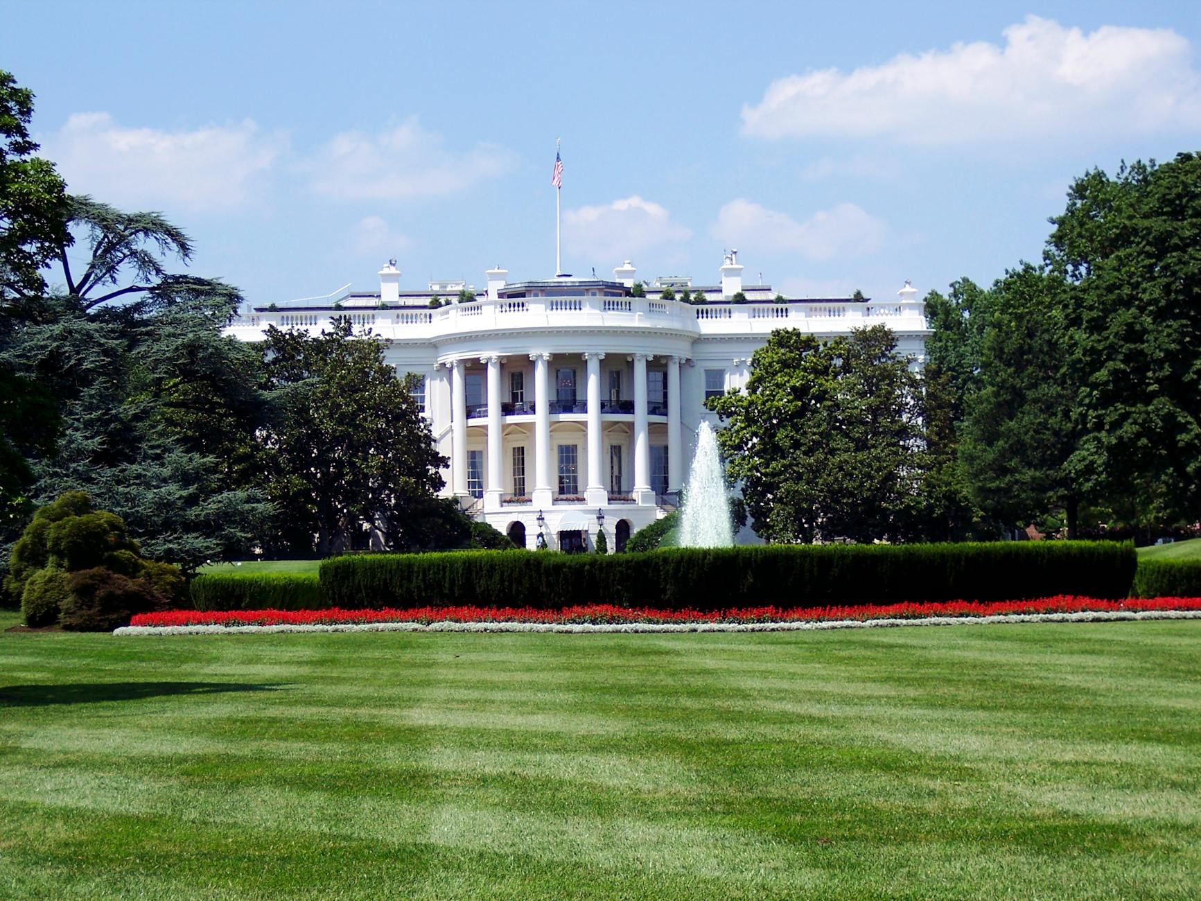 Iconic view of the White House with gardens and fountain in Washington