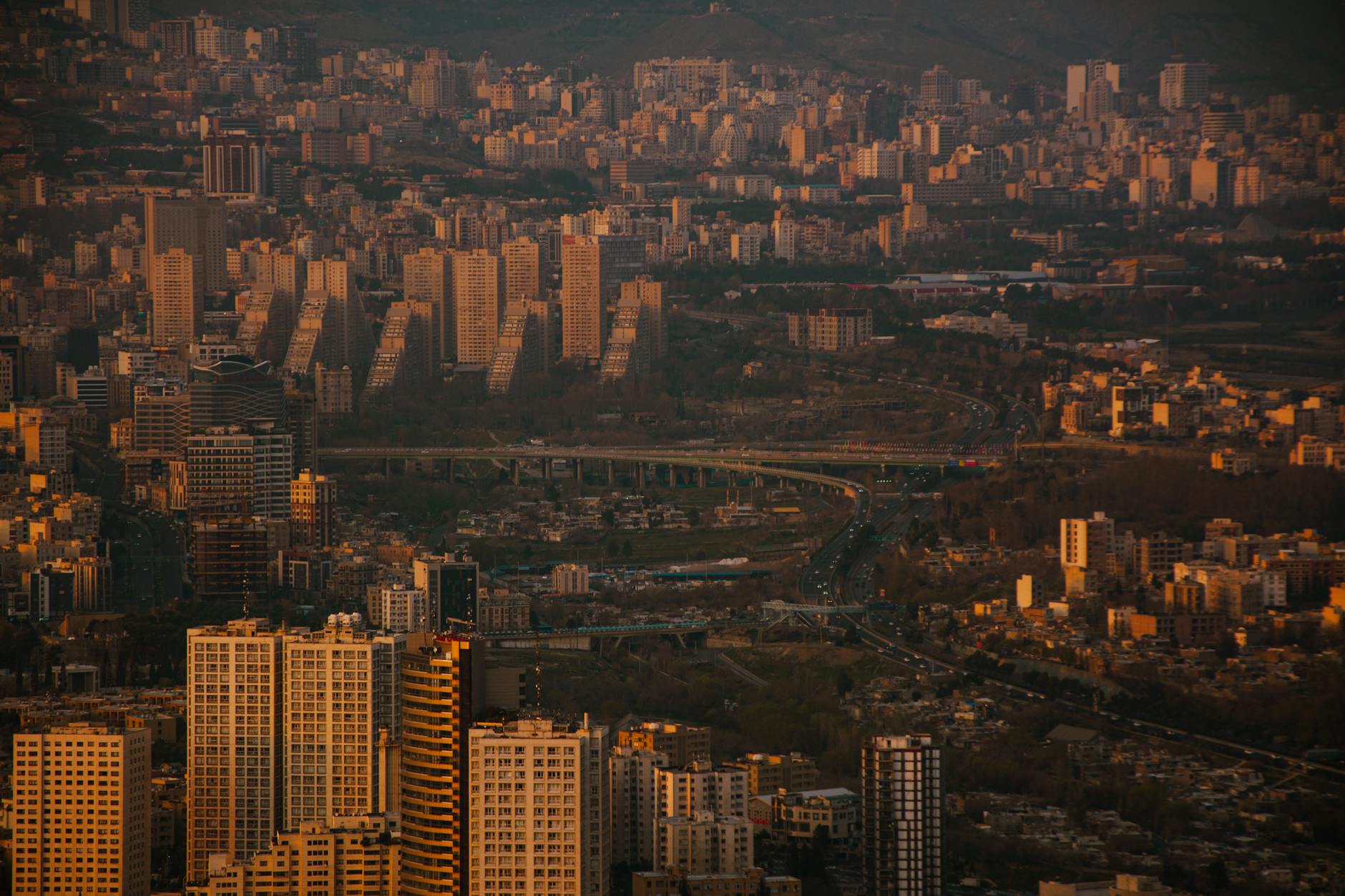 Aerial view of Tehran's skyline at dusk.