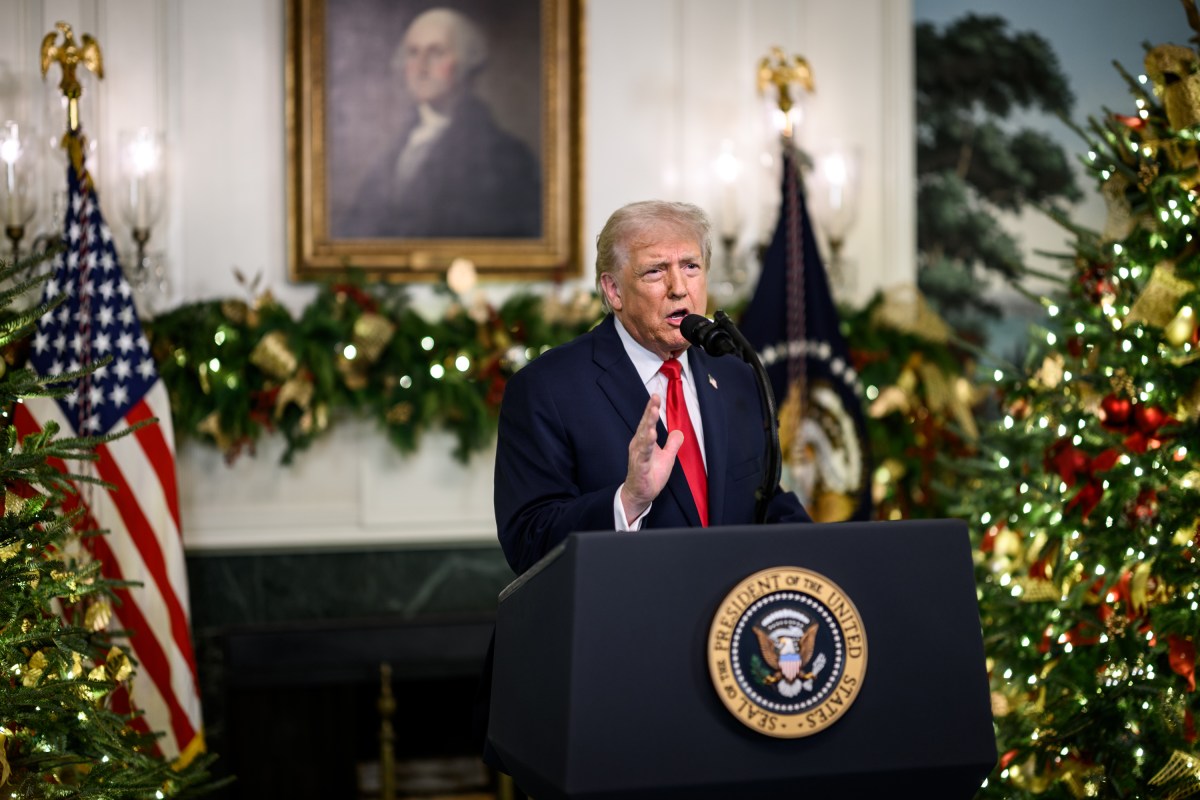 President Donald Trump speaks at a podium during a White House event.