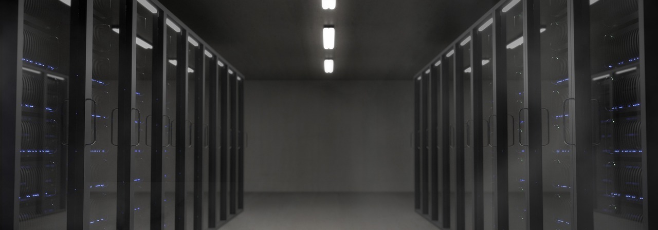 Rows of illuminated servers inside a data centre