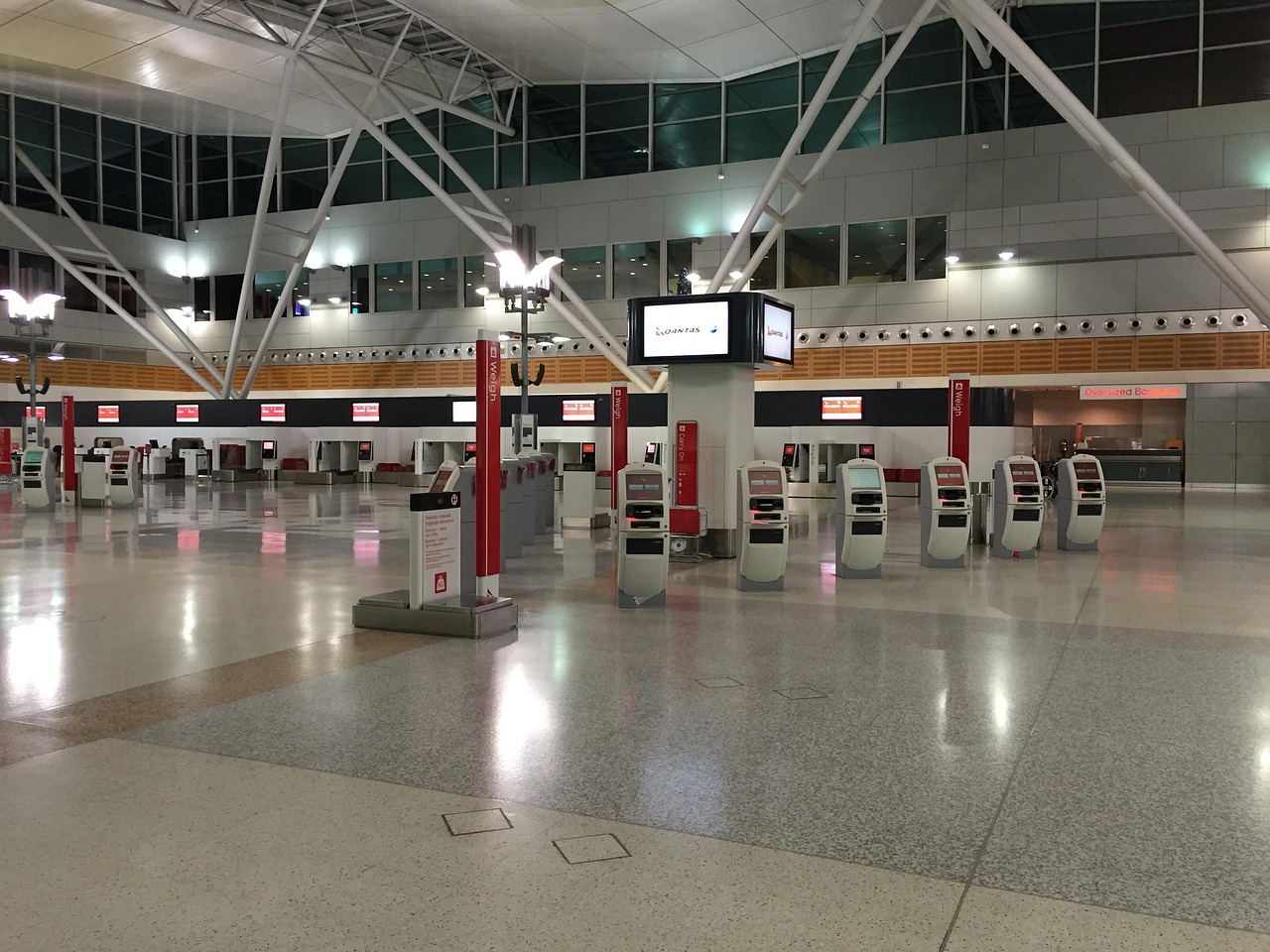 Airport terminal with passengers and luggage