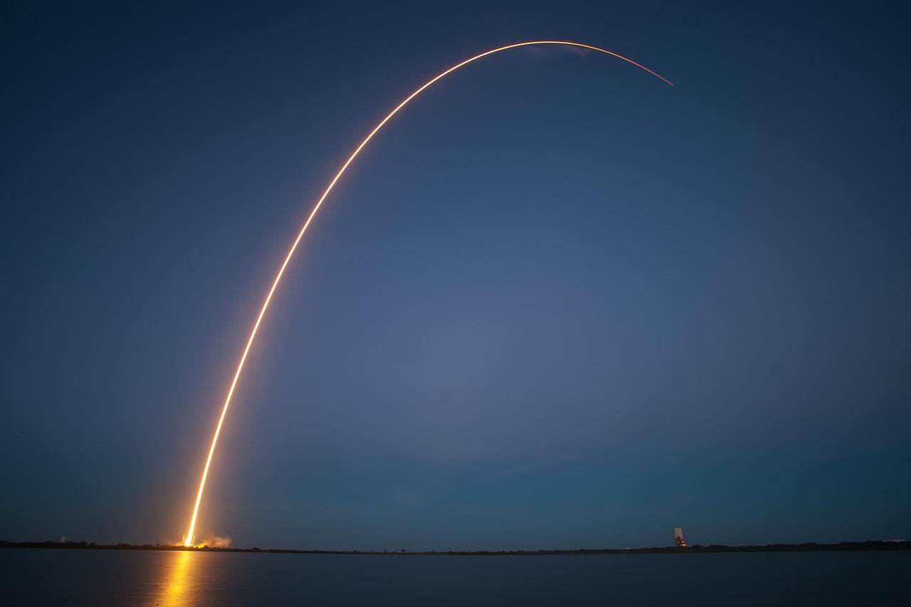 A SpaceX rocket lifts off at night, symbolising the company's move toward public markets.