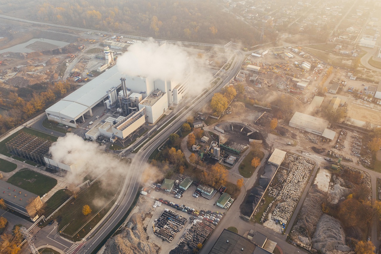 Industrial pollution over a city skyline as China carbon accounting faces scrutiny