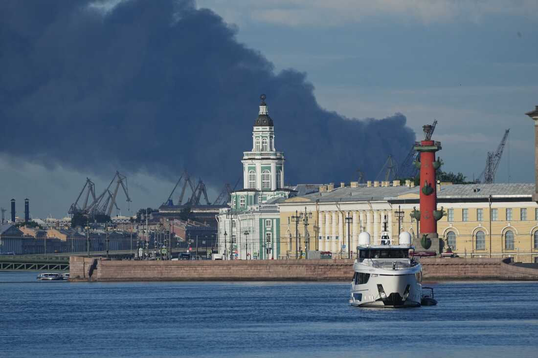 Black smoke rises over the port of St. Petersburg after a Ukrainian drone attack